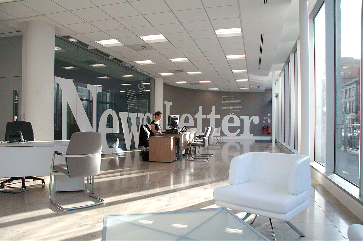 Newsletter Headquarters, reception area showing super graphics